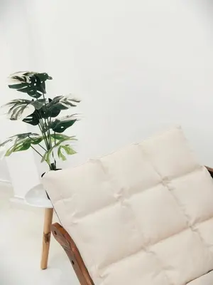 a white chair and a plant in a room at Fivehouse Silom2 soi11 City heart Silom BTS 7min in Bang Rak