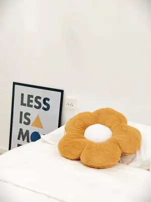 a brown teddy bear sitting on top of a bed at Fivehouse Silom2 soi11 City heart Silom BTS 7min in Bang Rak