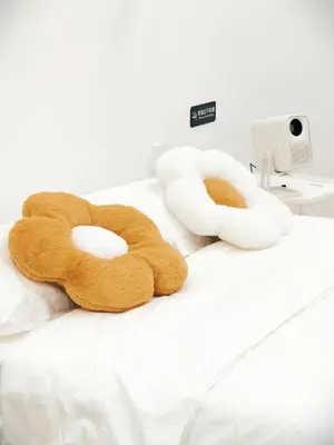 a stuffed teddy bear laying on a bed at Fivehouse Silom2 soi11 City heart Silom BTS 7min in Bang Rak