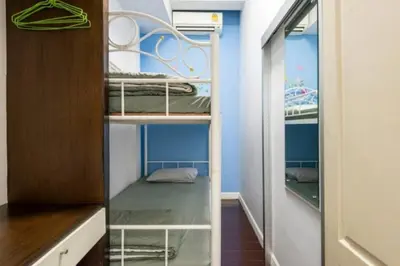 a bedroom with bunk beds in a room at 1137 Hostel in Bangkok
