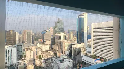 a view of a city skyline from a skyscraper at Silom room 40 sqm with 2 Queen beds for 4 persons in Bangkok