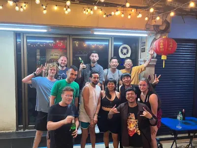 a group of people posing for a picture at The LODGE BKK Hostel in Bangkok