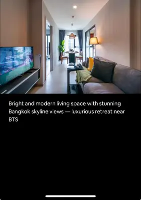 a living room with a couch and a flat screen tv at Luxurious Upscale Downtown Apartment in Bangkok