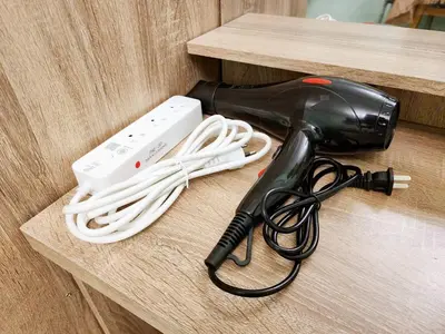 a hair dryer and a blow dryer on a table at 811-STP Homely room Free Wi-Fi and Near BTS Line in Bangkok