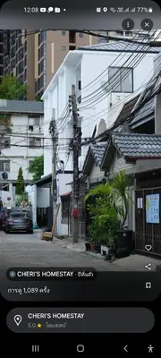 a screenshot of a phone screen with a picture of a city at Sirin Home in Bangkok