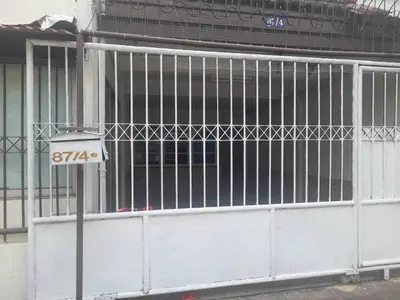 a gate on the side of a building at Sirin Home in Bangkok