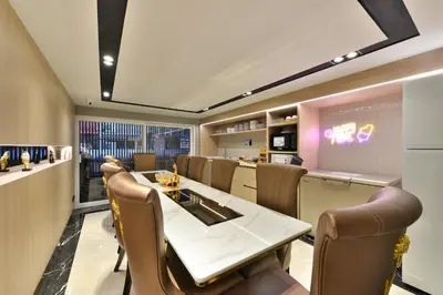 a dining room with a table and chairs at Victora Hostel in Bangkok