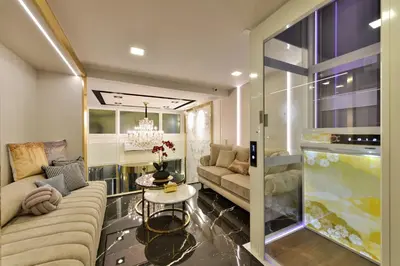 a living room with a couch and a table at Victora Hostel in Bangkok