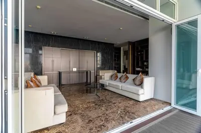 a living room with two white couches and a table at Thonglor area 1 Bedroom FastWiFi Sauna Big Swimming Pool 43 in Bangkok