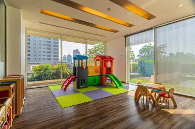 a childrens room with a play room with a playground at Thonglor area 1 Bedroom FastWiFi Sauna Big Swimming Pool 43 in Bangkok