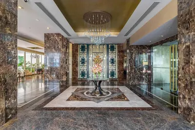 a large room with a chandelier and a lobby at Thonglor Area 1 bedroom Check in 24h Fast WiFi 98 in Bangkok