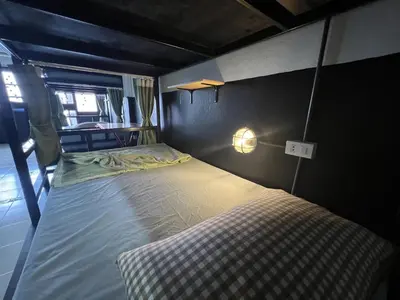a small bedroom with a bed in a room at Years 1981 in Bangkok