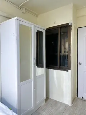 a room with two sliding doors and a window at Chubbi5 room11 in Bangkok