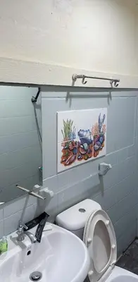 a bathroom with a white toilet and a sink at Chubbi5 room11 in Bangkok