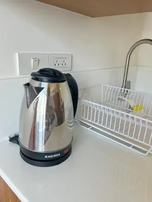 a tea kettle sitting on top of a kitchen counter at Brix26 in Bangkok