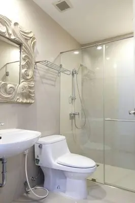 a bathroom with a shower and a toilet and a sink at Townhome 3 bed4 Baht Asok MRTBTS Sukhumvit 16 in Bangkok