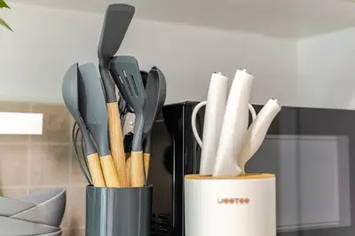a container filled with utensils in a kitchen at Perfect 1BR at MRT Bangson By Orn in Bang Su
