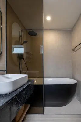a bathroom with a sink and a bath tub at Whole Floor Penthouse, 3 Bedroom 3 Bath, Next to Metro Station in Bangkok