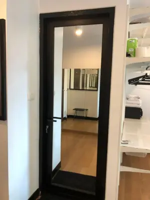 a door leading into a room with a bunk bed at Bangkok Feliz Sukumvit69 in Bangkok