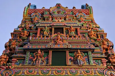 an ornate building with paintings on the top of it at GO INN Silom BTS Surasak สถานีสุรศักดิ์ in Bangkok