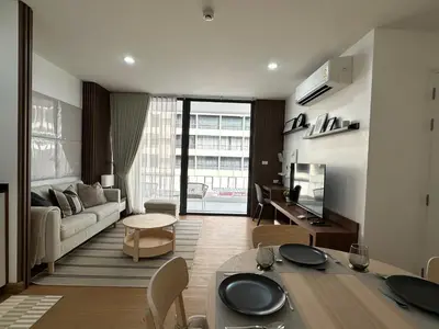 a living room with a couch and a table at 6th Avenue Sukhumvit BKK 302 BTS Asoke & Nana MRT Sukhumvit in Bangkok