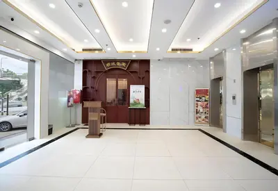a lobby of a building with a revolving door at Palette The Travellers Hotel Bangkok in Bangkok