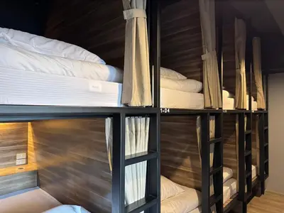 a group of bunk beds in a room at Fellows House in Bangkok