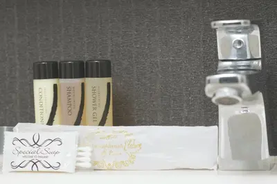 two bottles of moisturizing soap next to a dispenser at Park 19 Hotel in Bangkok