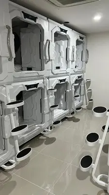 a room with a bunch of sinks and toilets at Kiwi Capsule Hotel in Bangkok