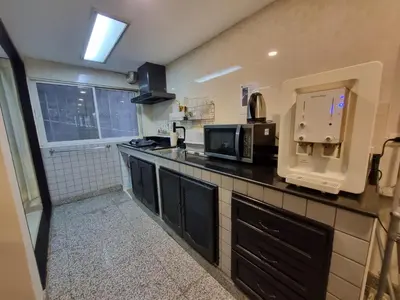 a kitchen with a counter top with a microwave at RB9 Oliver's House in Kaset in Ban Yang
