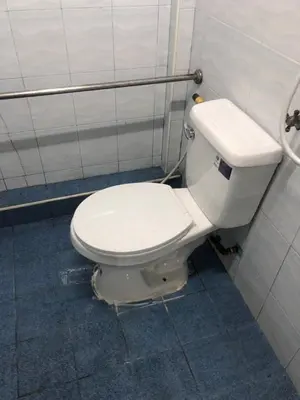 a bathroom with a white toilet in a stall at PTT Mansion ปทิตา แมนชั่น in Ban Zong Katiam