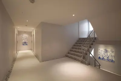 a staircase in a building with a stair case at K Maison Boutique Hotel in Bangkok