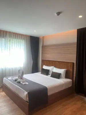 a bedroom with a large bed with a window at Spacious Bedroom- 2 mins from Train Station in Bangkok