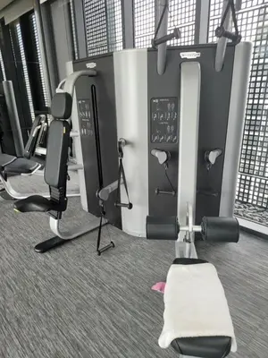 a gym with several treadmills and exercise equipment at Appartement douillet pool fitness in Bangkok