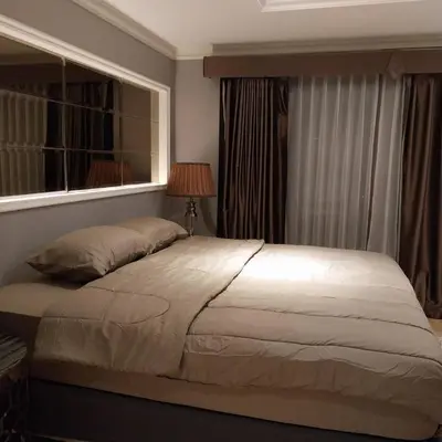 a large bed in a bedroom with a window at NEW 1 bedroom 46FL Bangrak City view in Chinatown