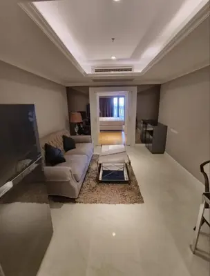 a living room with a couch and a flat screen tv at NEW 1 bedroom 46FL Bangrak City view in Chinatown