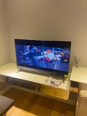 a large flat screen tv sitting on a table at NEW 1 bedroom 46FL Bangrak City view in Chinatown