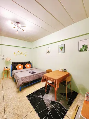 a bedroom with a bed and a table in it at 703-STP Homely room Free Wi-Fi and Near BTS line in Bangkok