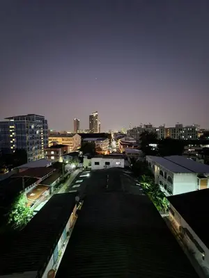 a view of a city street at night at 703-STP Homely room Free Wi-Fi and Near BTS line in Bangkok