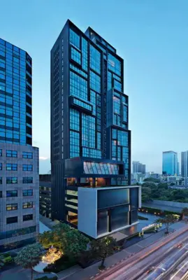 a rendering of a tall building in a city at Mövenpick Residence Ekkamai in Sathani Khlong Tan