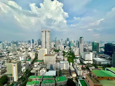 a large city with tall buildings in the sky at BangrakHomey - Cozy private Apartment in State tower bangkok in Bangkok