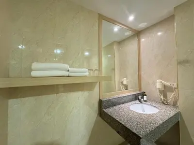 a bathroom with a sink and a mirror at iCheck inn Thapra in Bangkok