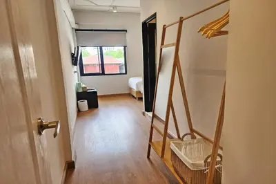 a hallway with a room with a bunk bed at Shade House Bangkok Oldtown in Bangkok
