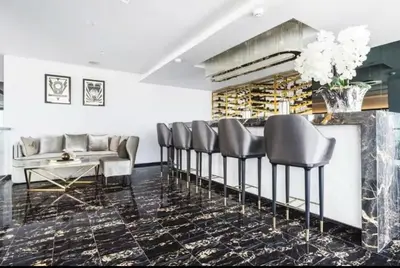 a lobby with chairs and a couch and a table at Condo Luxe Siam Pool 360 Near BTS Shopping in Bangkok