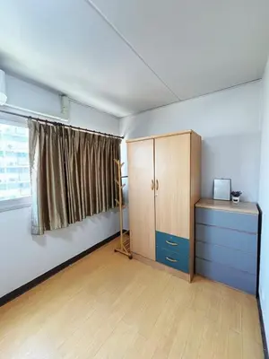 an empty room with a cabinet and a window at Impact - Don Mueng Condo C5 in Thung Si Kan