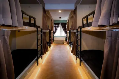 a hallway with many bunk beds in a room at Mind Day Hostel Khaosan in Bangkok