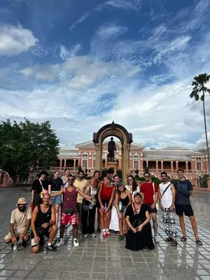 a group of people posing in front of a building at Here Hostel Bangkok in Bangkok