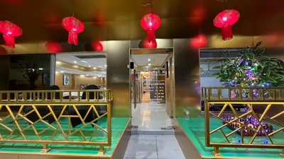 a store with red lights hanging from the ceiling at Golden Mango home hotel \u91d1\u8292\u679c\u4e4b\u5bb6\u9152\u5e97 in Bangkok