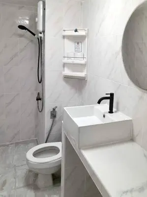 a white bathroom with a sink and a toilet at Impact Arena Condo 2Rooms C3 by GoodRoom24 in Ban Bang Phang