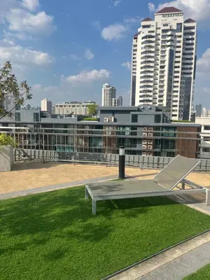 a bench on the roof of a building at Executive Apartment Thonglor in Bangkok